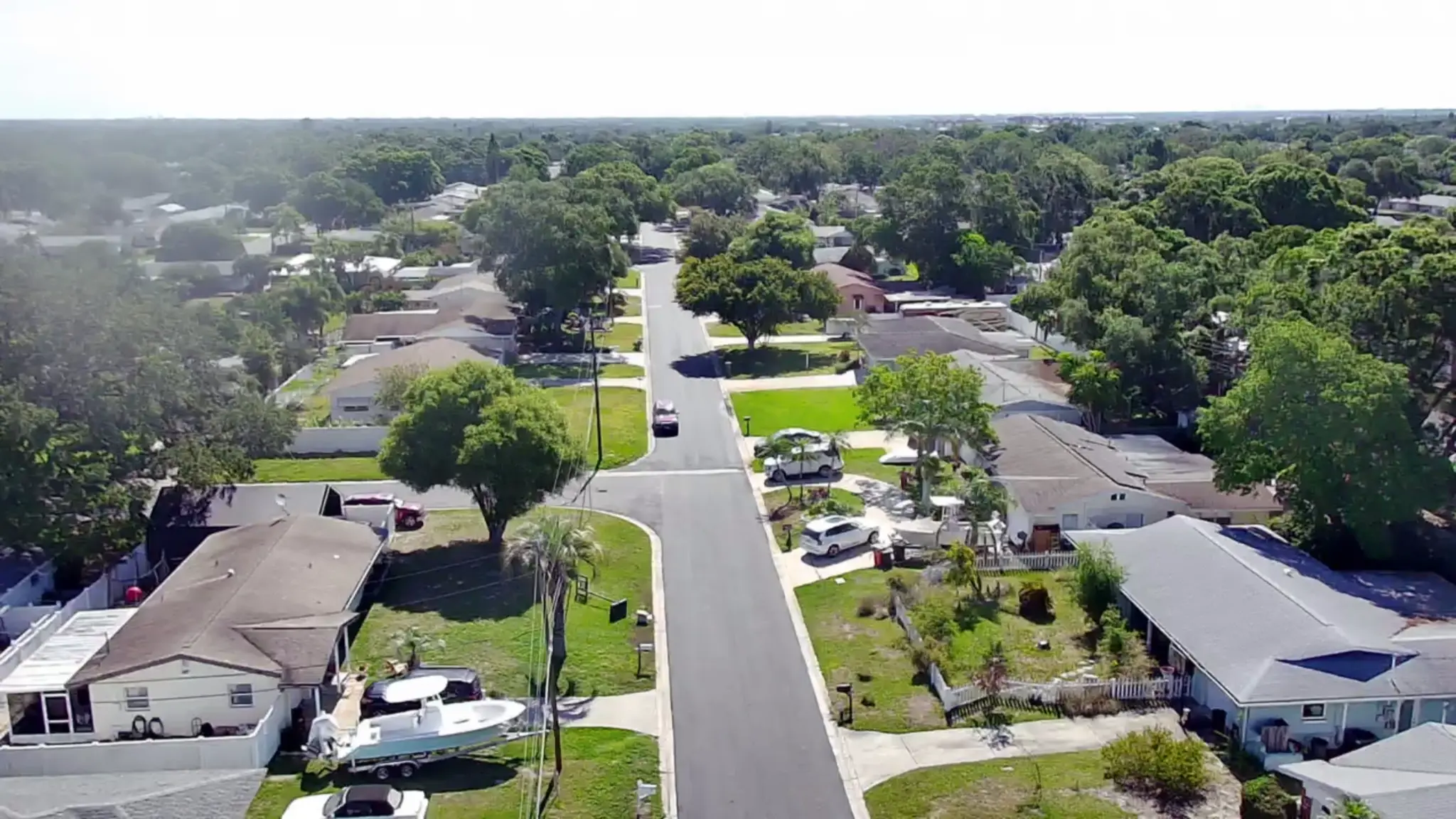 Blacktop Florida crew operating paver on commercial site