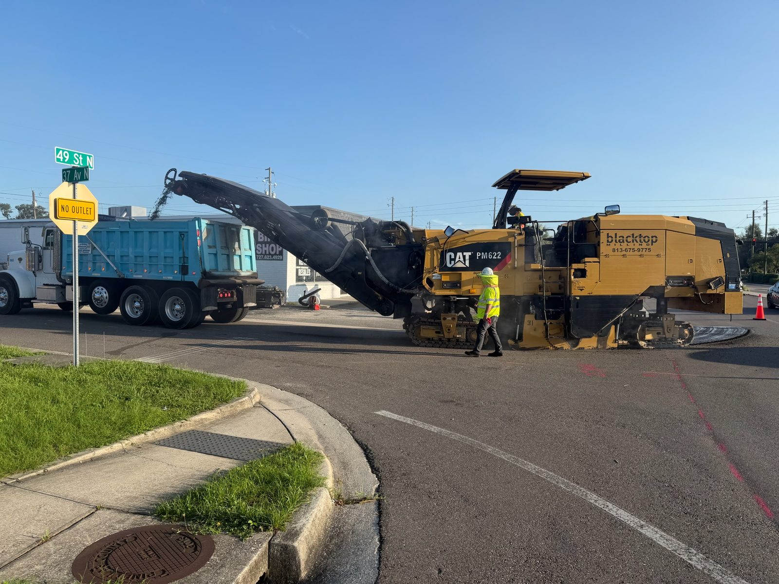 CAT PM622 cold planer milling the existing asphalt surface at 49th St N / 37th Ave N, Madeira Beach, FL