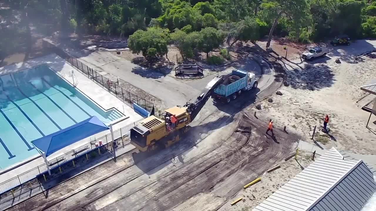 Drone aerial view of an active paving operation — Central Florida